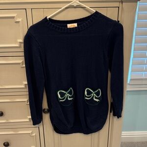 The Beaufort Bonnet Company Navy Sweater with Green Bow Accents